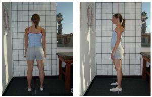 Woman stands in front of a posture grid