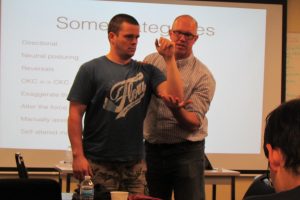 physiotherapist teaching shoulder assessment