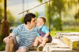 dad kisses son descending modulation pain massage therapy