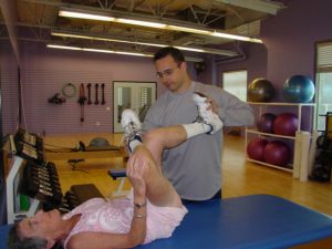 personal trainer passive stretching client