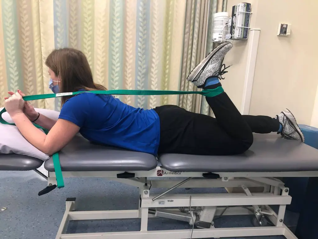 prone quadriceps stretch with band PFPS