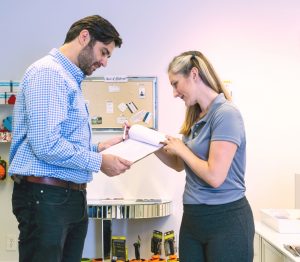 massage therapist shows client informed consent