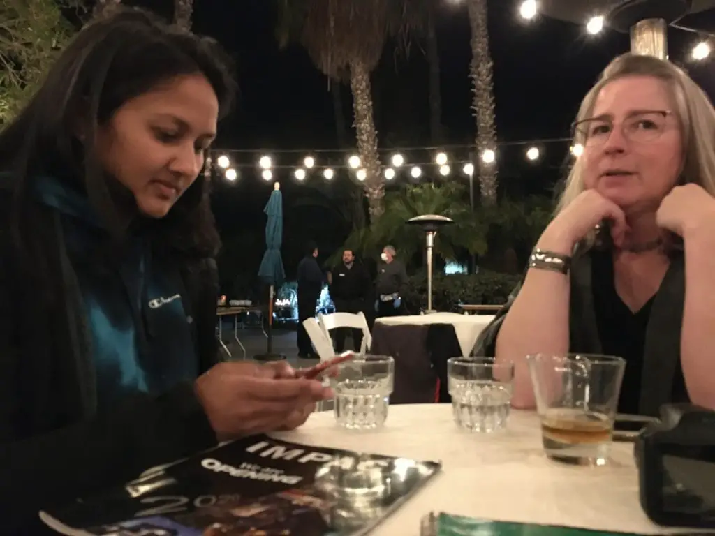 Sheela Ivlev, MS, OTR/L, (l) and Rajam Roose catch up on their lives over dinner at the 2022 San Diego Pain Summit. Friday, Feb. 25, 2022. (Photo by Nick Ng)