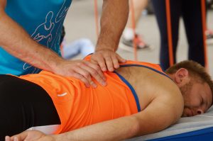 Sports massage therapists help athletes after a marathon race in Saint-Petersburg on Sept. 7, 2017. (Photo by aleksandr72)