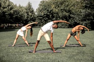 Group stretching outdoors for tight muscles. (Photo credit: Monstera)