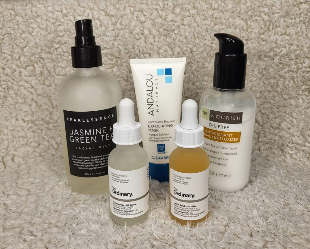 Five bottles of skin care products with peptides.